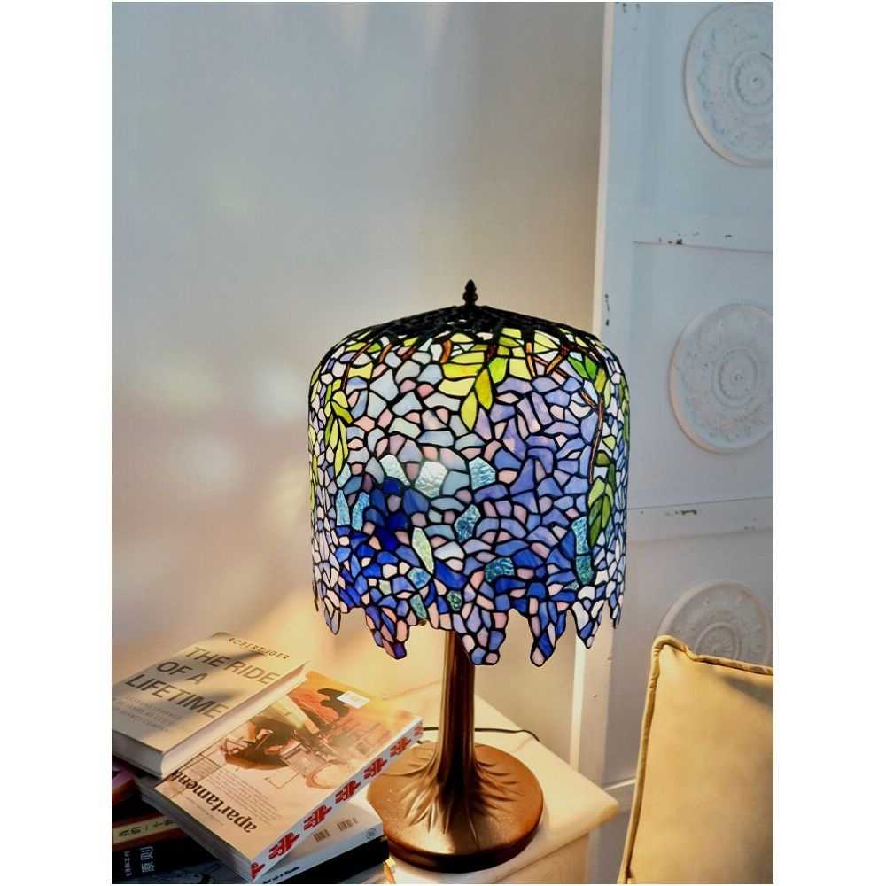 Decorative table lamp with stained glass shade on a nightstand