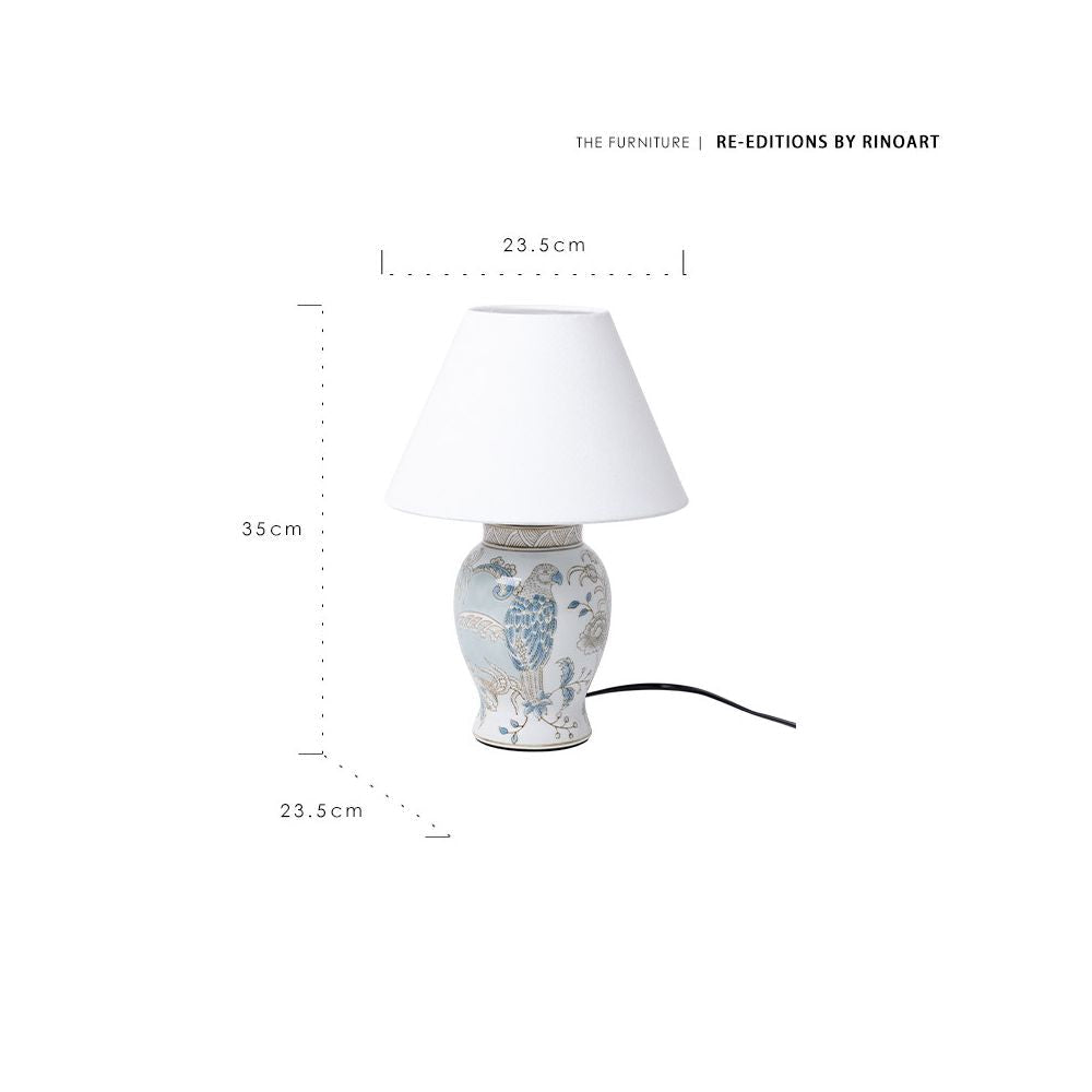 Table lamp with decorative base and white shade, featuring Rinoart branding and measurements.